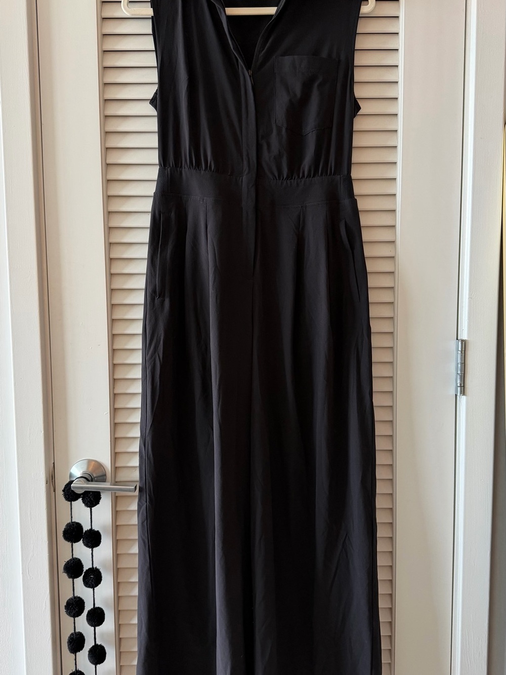 Athleta Black Sleeveless Jumpsuit with V-Neck and Pockets